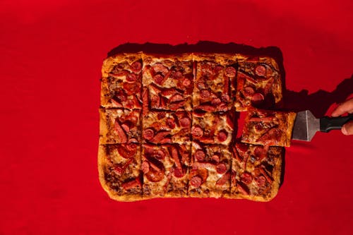 Sliced Rectangular Pizza with Sausages