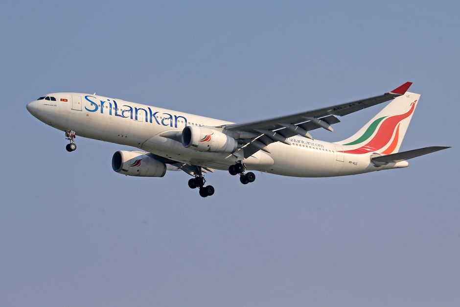 SriLankan Airlines aircraft parked at a gate in Sri Lanka
