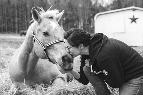 Woman Kissing Horse in Black and White