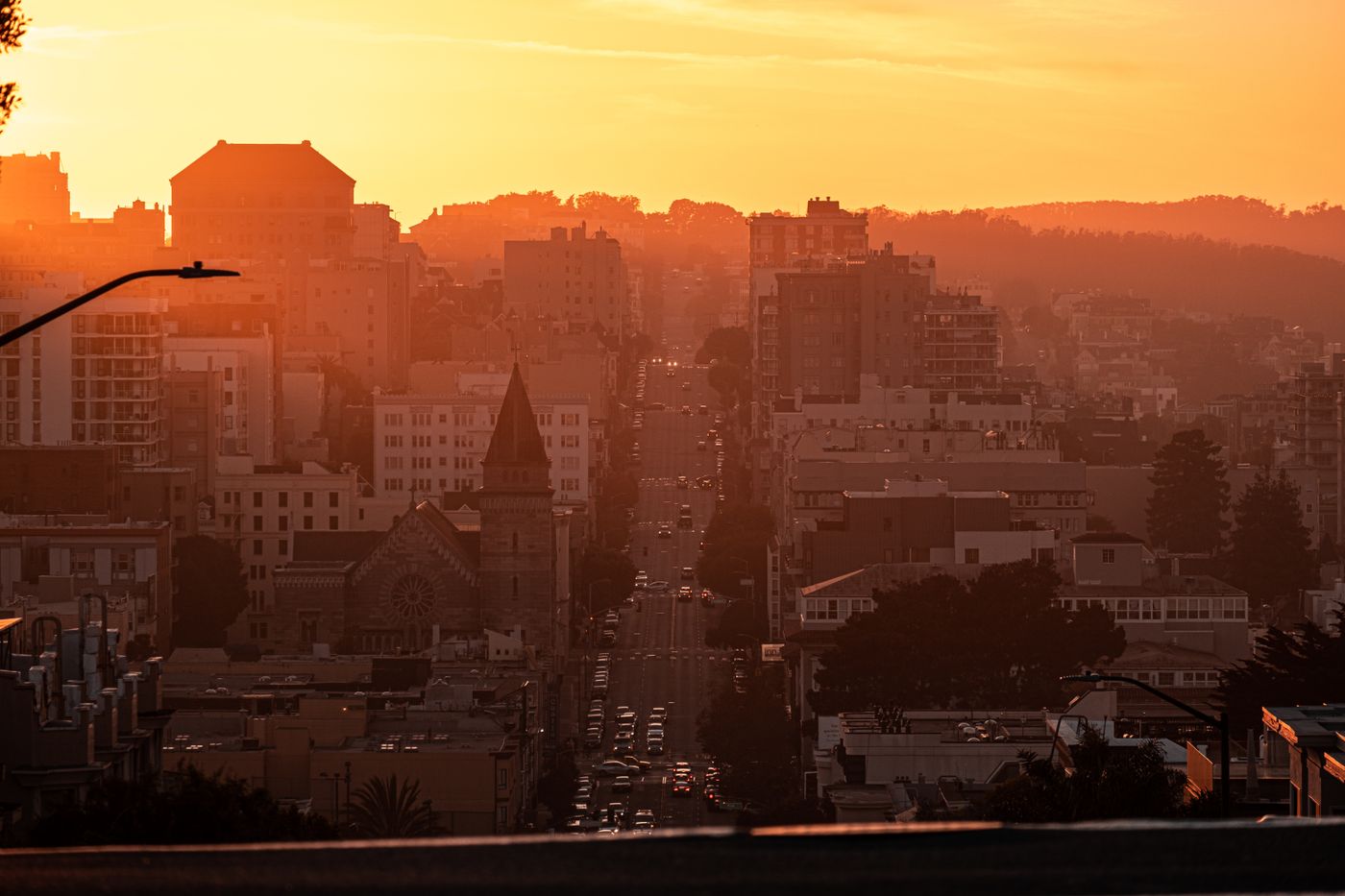City skyline in warm golden light at sunset — photo by Mo Eid on Pexels