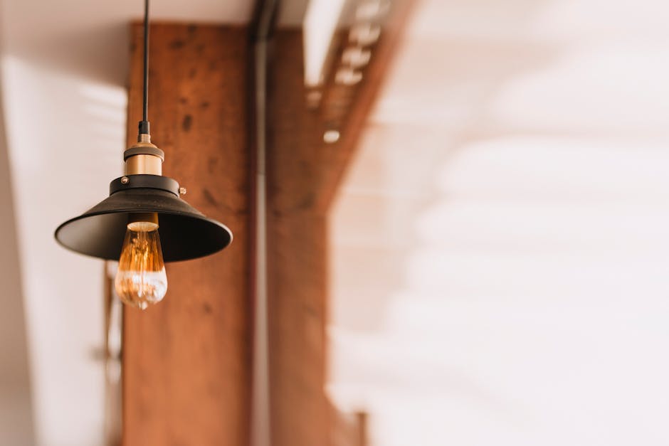 Shallow Focus Photography of Black and Orange Pendant Lamp