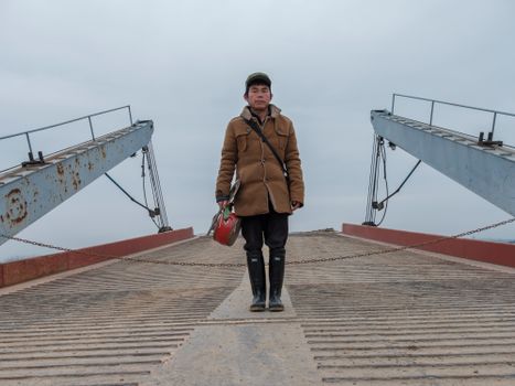 Elderly Man Standing in Port