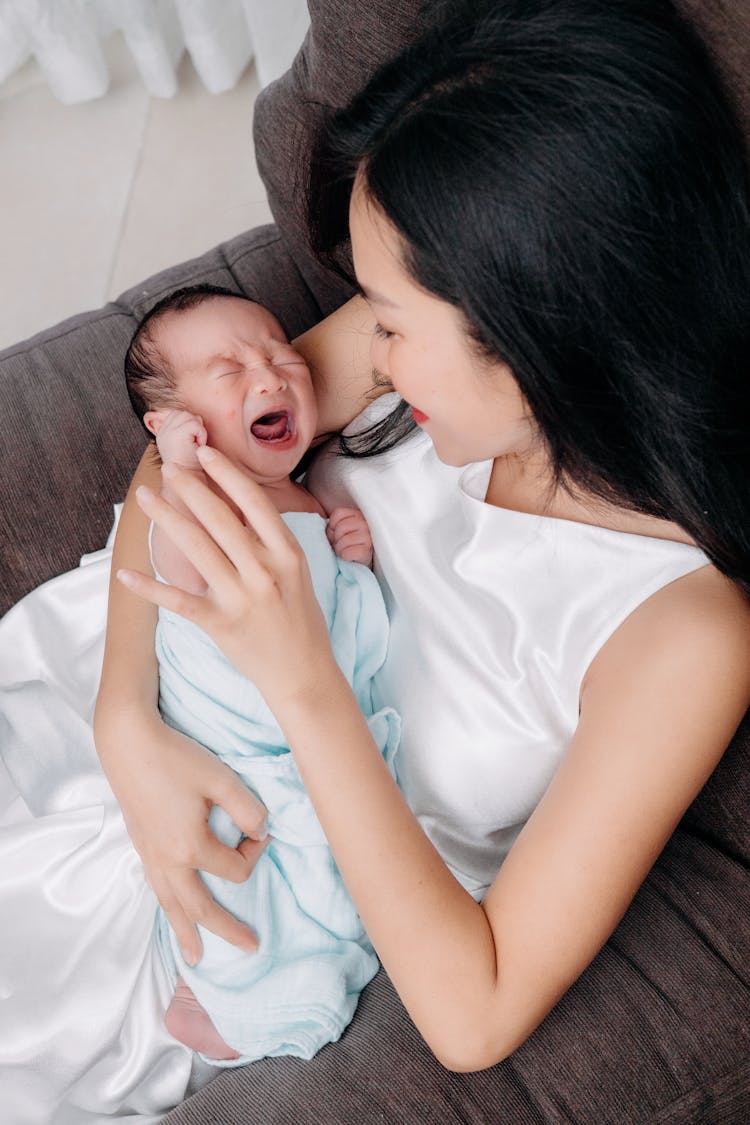 Mother Holding Crying Baby