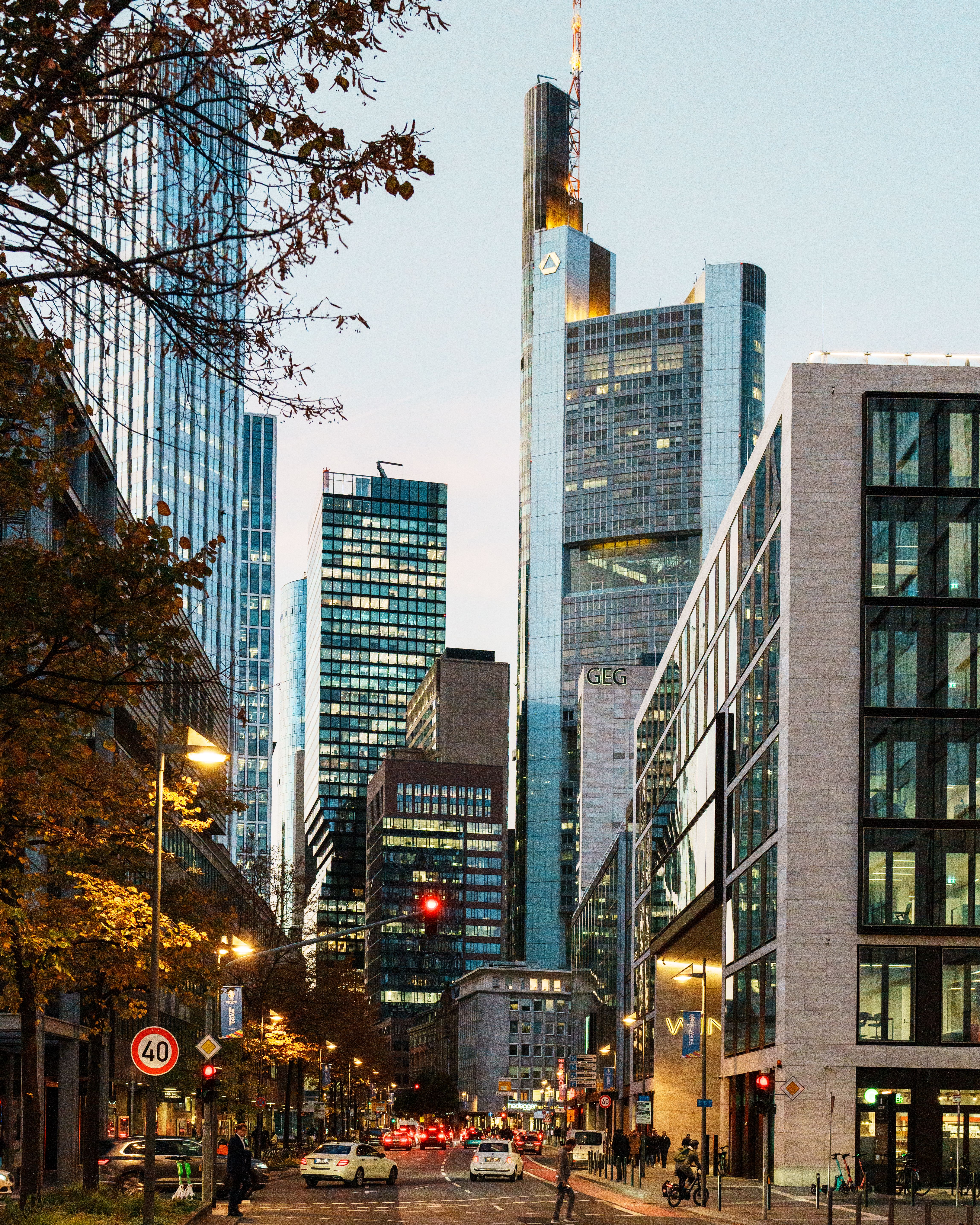 Stunning view of Frankfurt skyline featuring iconic skyscrapers and city lights during twilight.
