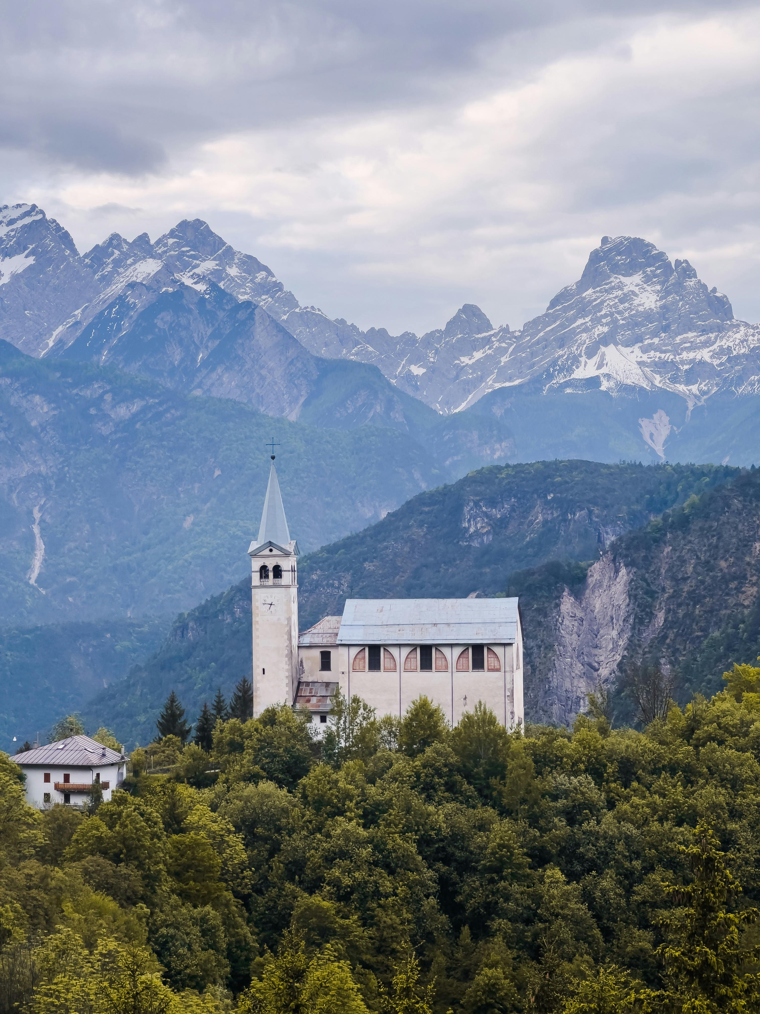 Scenic view of Church of San Martino against the backdrop of the Dolomite Mountains in Italy.