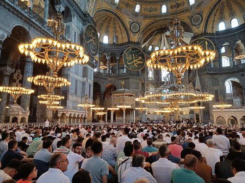 Free A crowd gathered for prayers inside the historic Hagia Sophia Mosque in Istanbul, Türkiye. Stock Photo