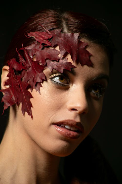 Red Leaves on Woman Face