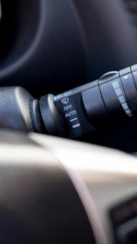 Detailed view of a car's wiper control switch, showcasing automotive design.