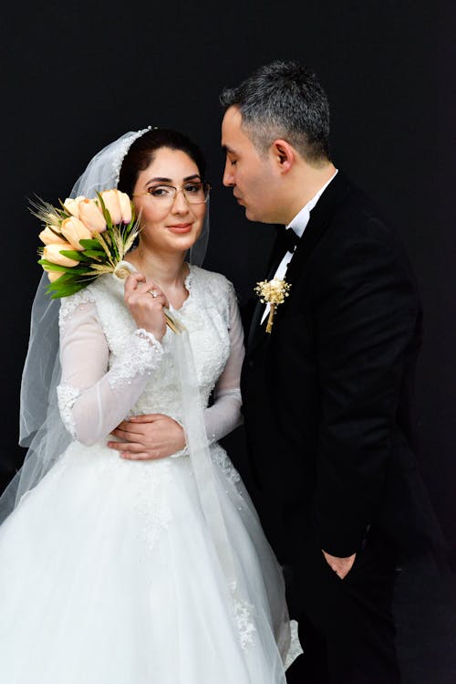 Newlyweds in Suit and Wedding Dress