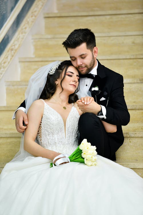 Newlyweds Embracing on the Stairs