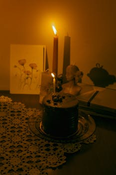 A warm, cozy scene with cake and candles on a decorated table, perfect for celebrations.