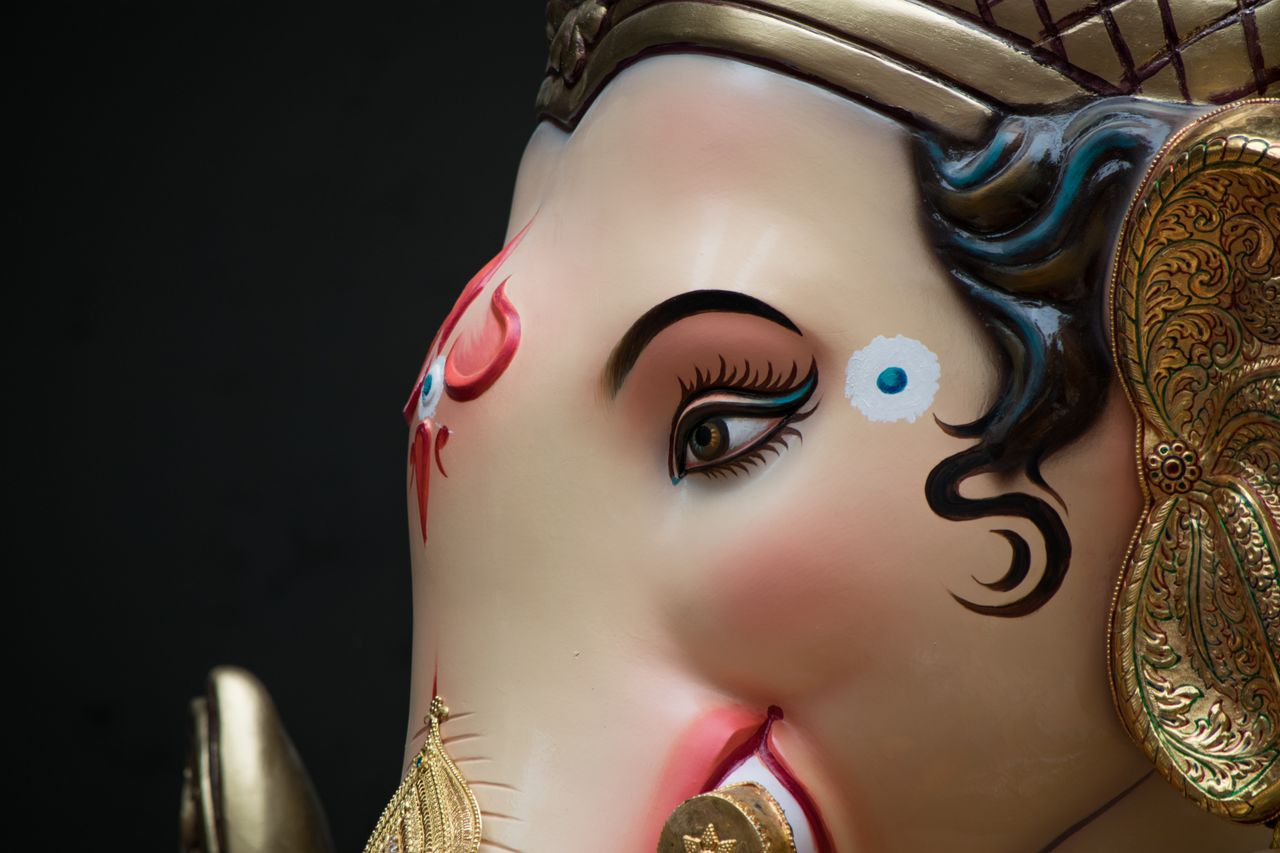 detailed close up of a ganesh idol showcasing intricate artistry in mu