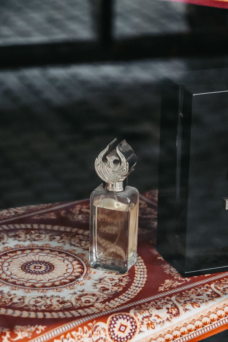 Vial Of Perfume On Traditional Carpet