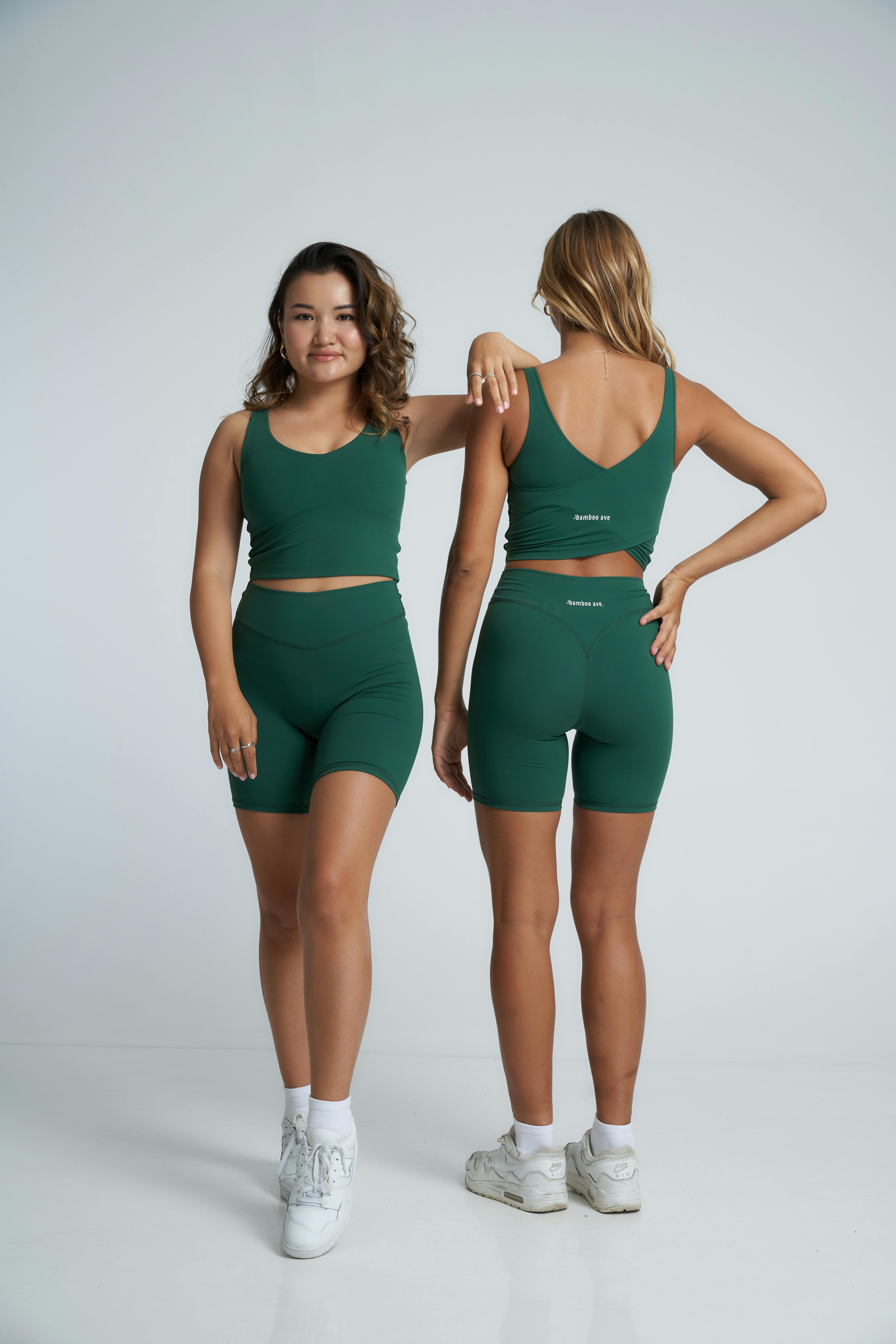 Two women in green sports bras and shorts · Free Stock Photo