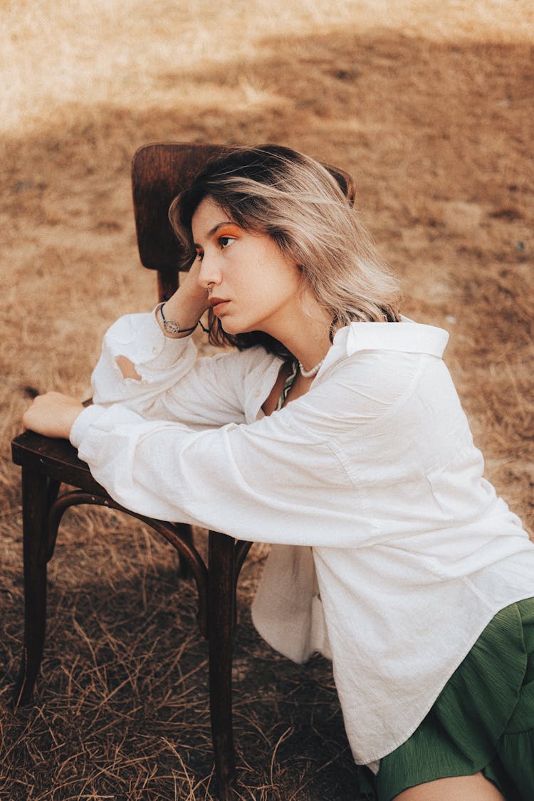 Woman Leaning On Chair