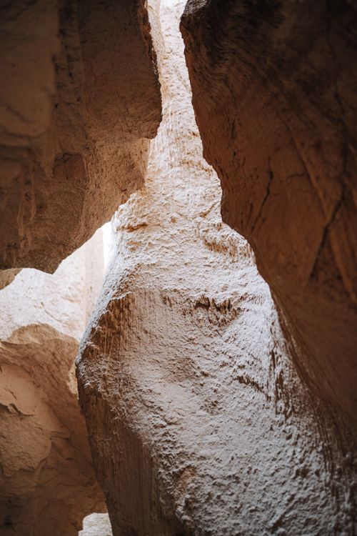 Free Close-up view of eroded rock textures in a sunlit narrow canyon showcasing natural formations. Stock Photo