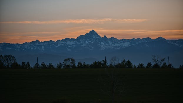 Snowy Alps at sunrise, viewed from Sommariva del Bosco, Piedmont.