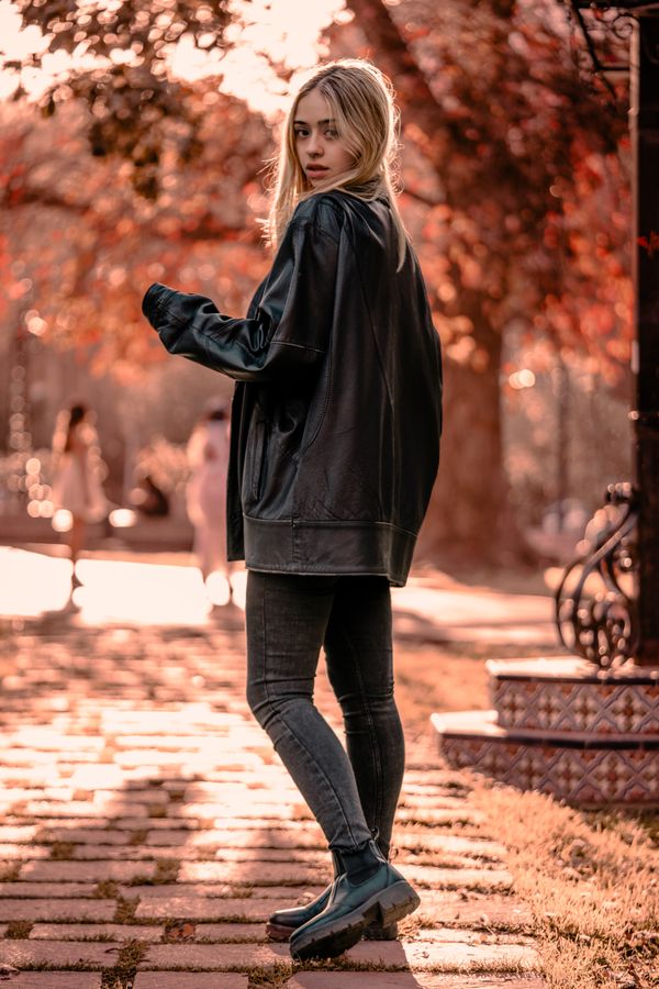 woman in plaid shacket and black jeans with combat boots