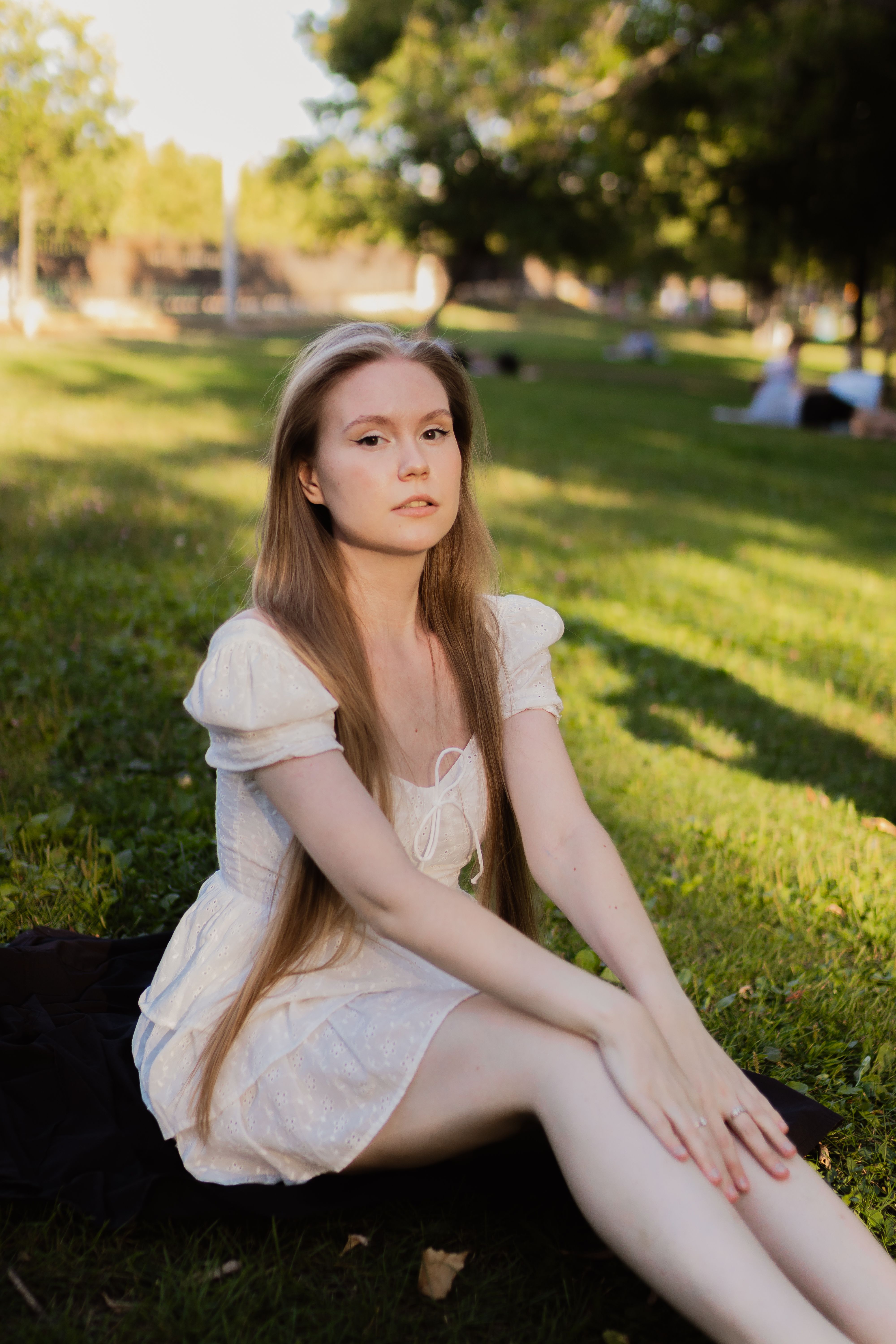 Woman Wearing Pink Dress Sitting in a Park · Free Stock Photo
