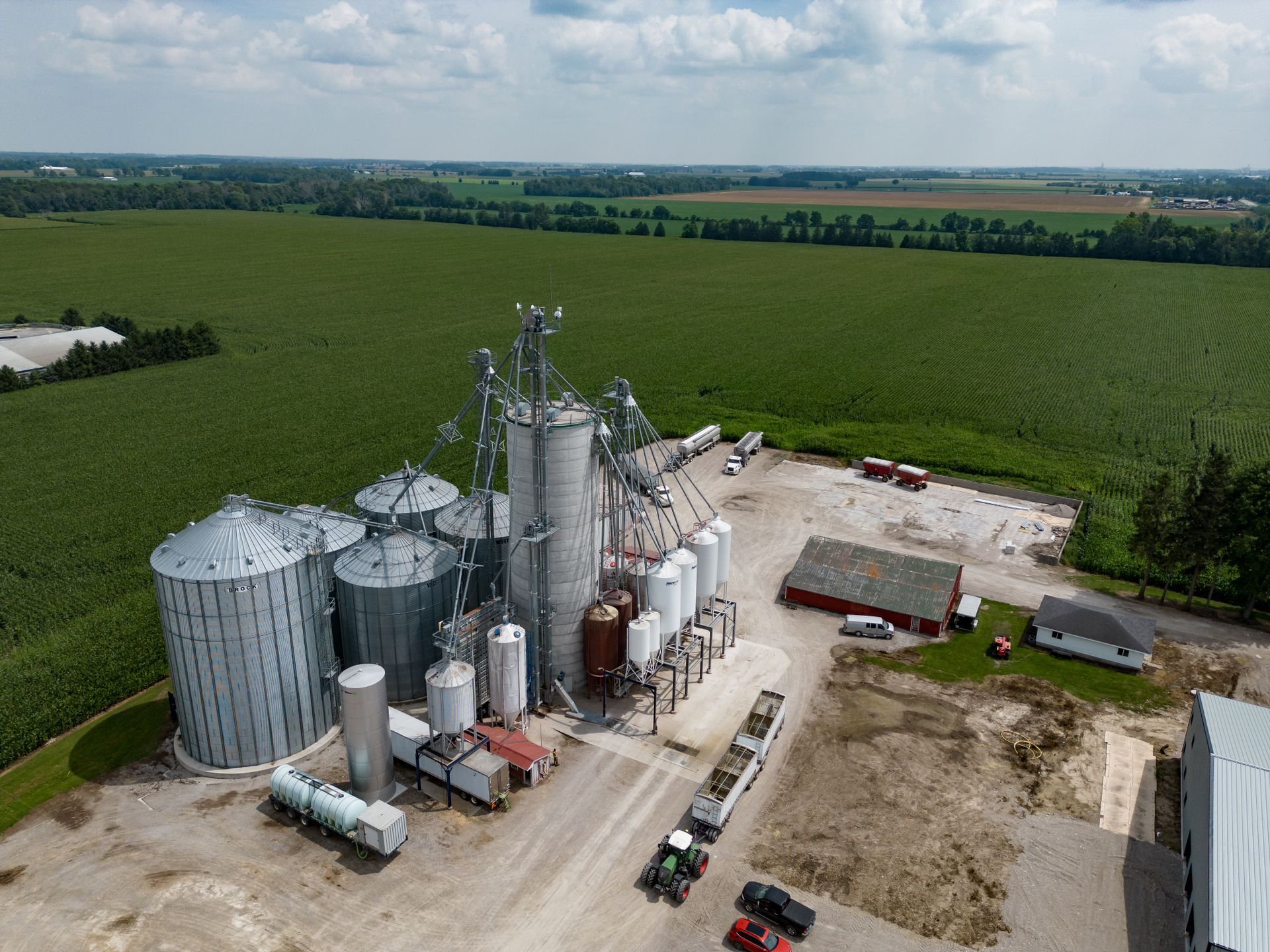 Drone shot capturing grain silos and vast fields in Dublin, Ontario, Canada.