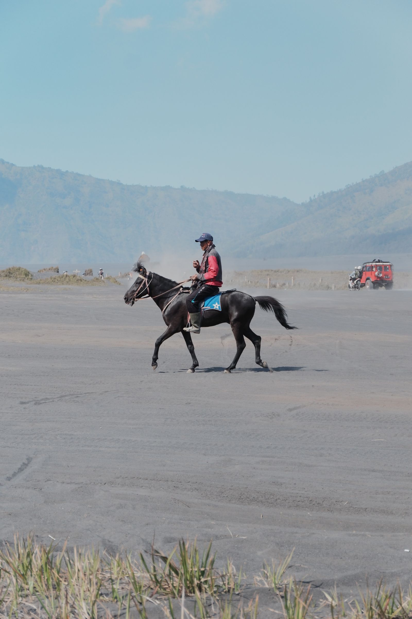 Rider travelling across a remote desert landscape