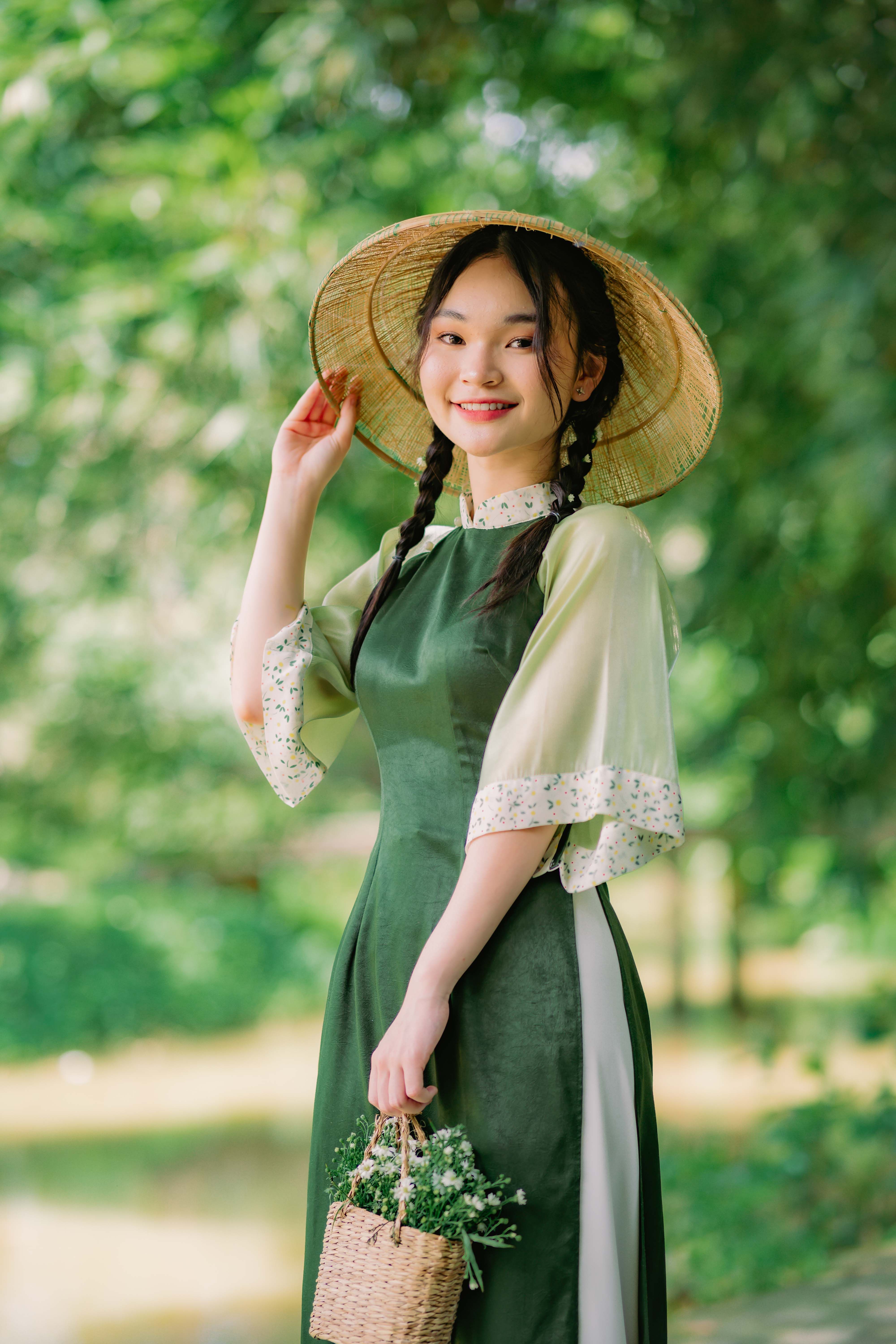 Woman in Green Dress and Conial Hat  Free Stock Photo