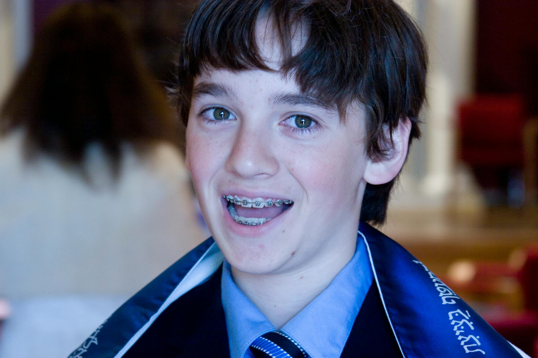 free photo of smiling boy with teeth braces