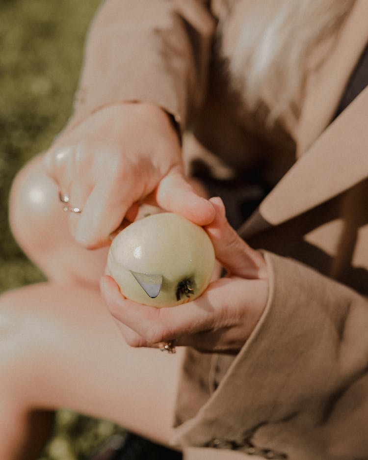 Woman Hands Cutting Apple