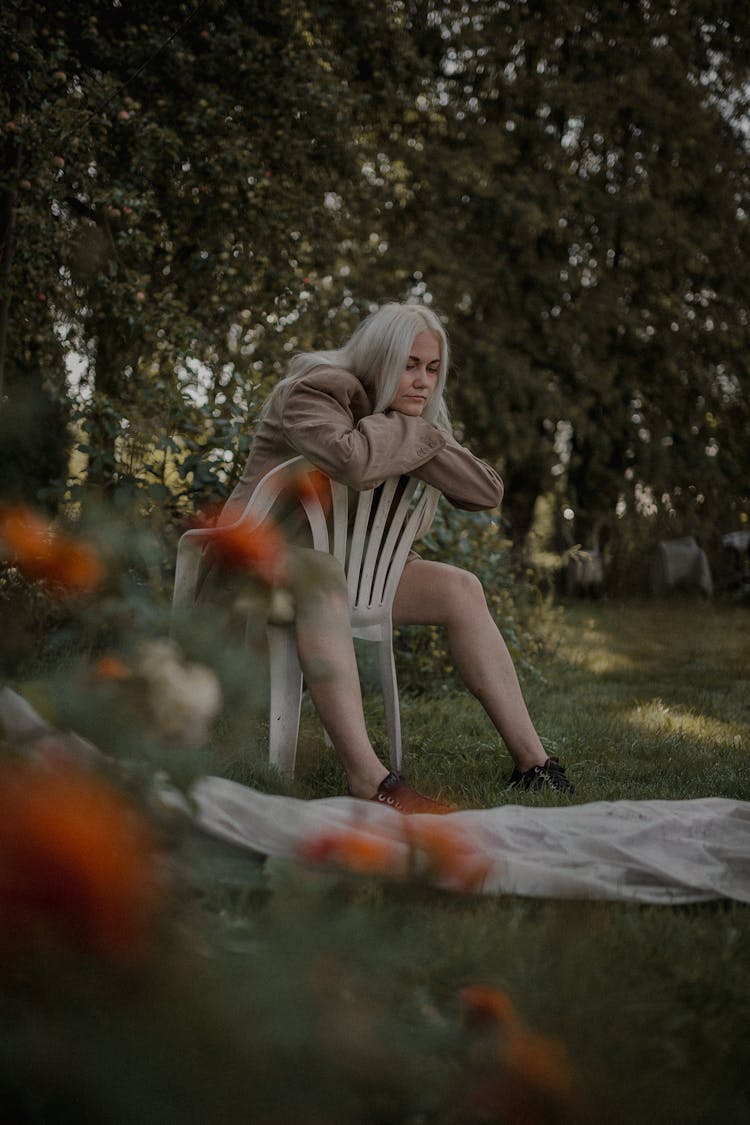 Woman With Gray Hair Sitting On Chair