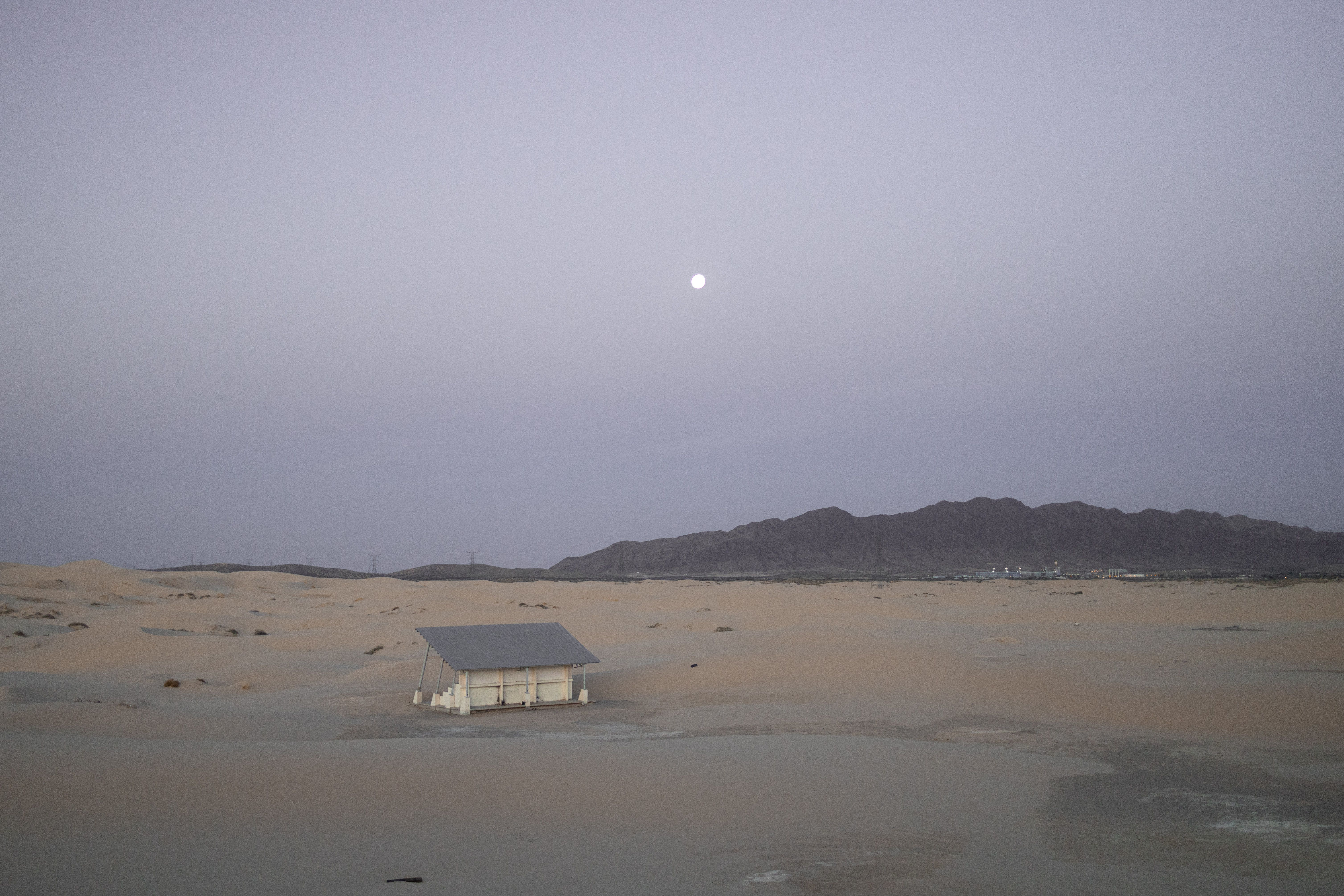 Serene view of an abandoned house in Samalayuca Desert under the early morning moonlight. Serene view of an abandoned house in Samalayuca Desert under the early morning moonlight.