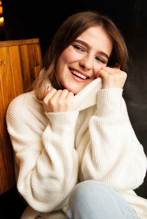 Brunette Woman Posing in White Turtleneck Sweater