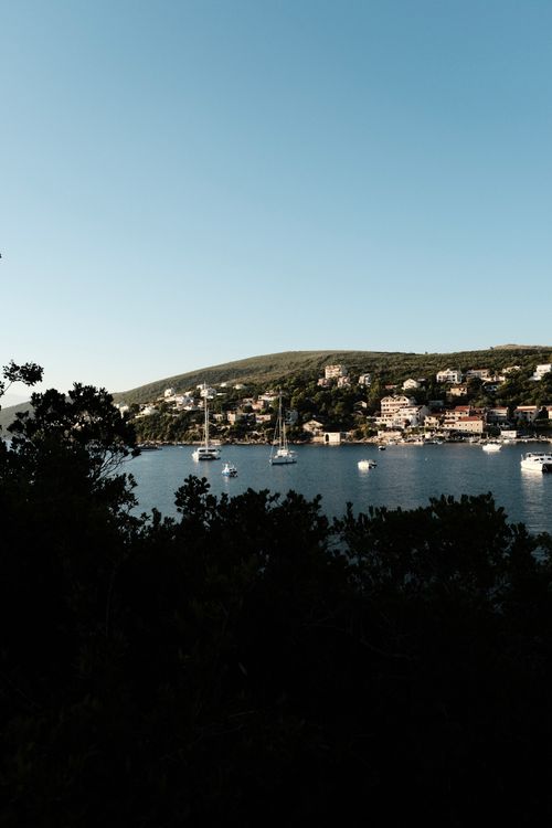 Free Stunning view of Bigova bay with boats and hills in Montenegro under a clear sky. Stock Photo