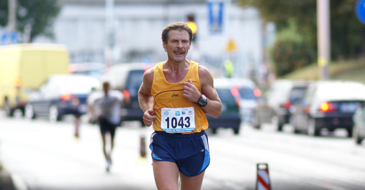 Man Running Marathon on City Street · Free Stock Photo