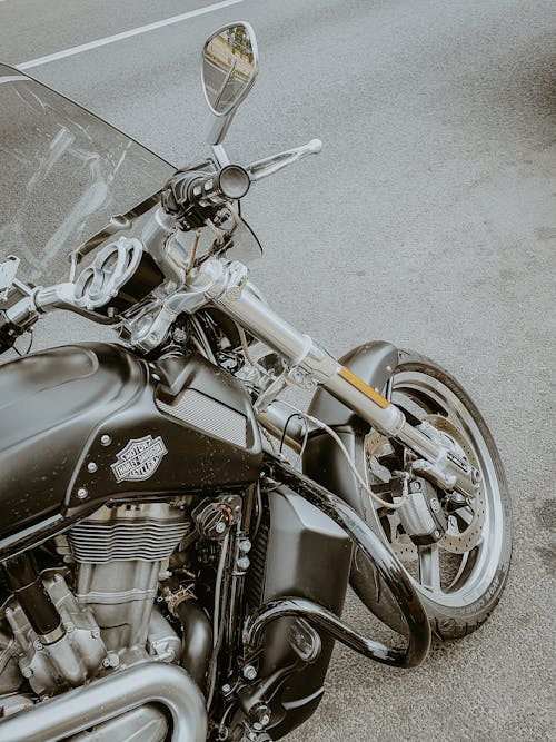Desaturated Photo of Harley-Davidson Motorcycle Parked on a Street 