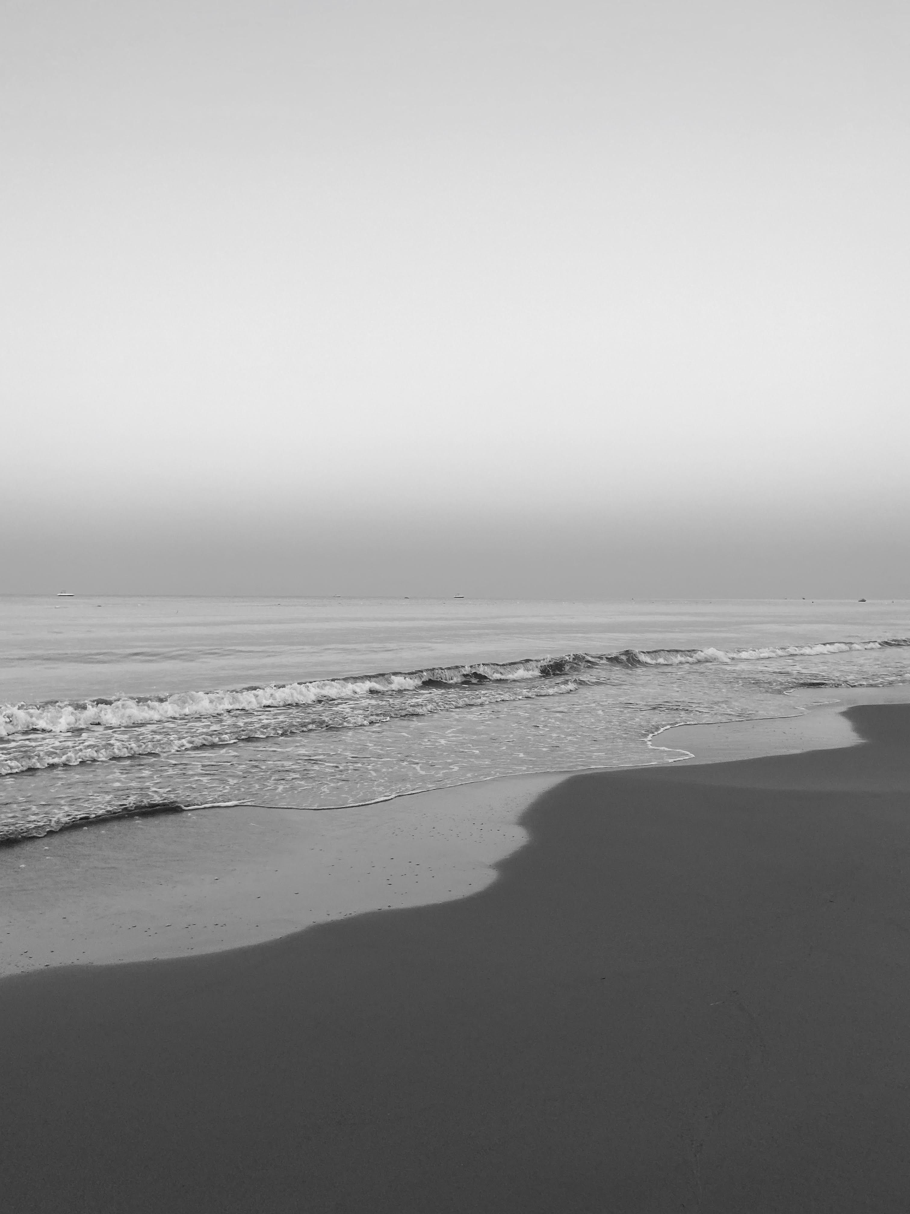 Black and White Photo of Waves Washing Up the Beach · Free Stock Photo