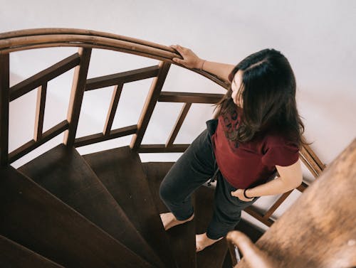 Woman Going Up The Stairs