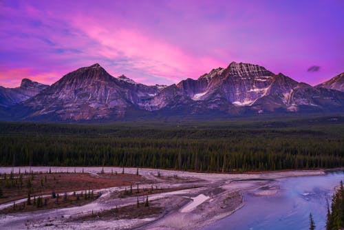 Road in a Mountain Valley During Sunset 