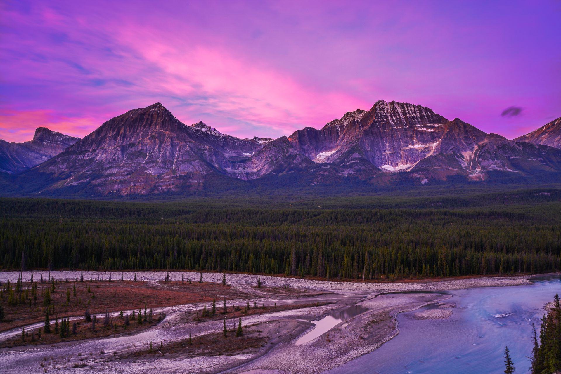 Alberta countryside landscape with mountains at sunset