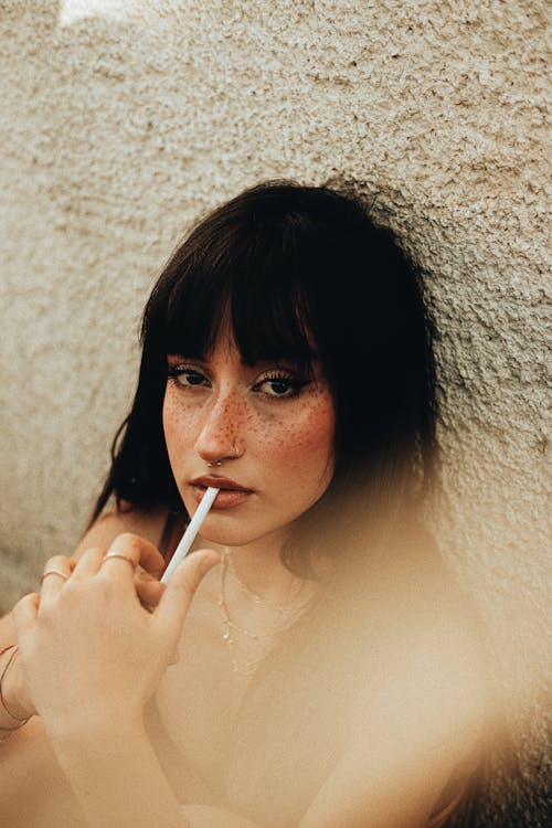 Portrait of a Brunette Woman with a Cigarette