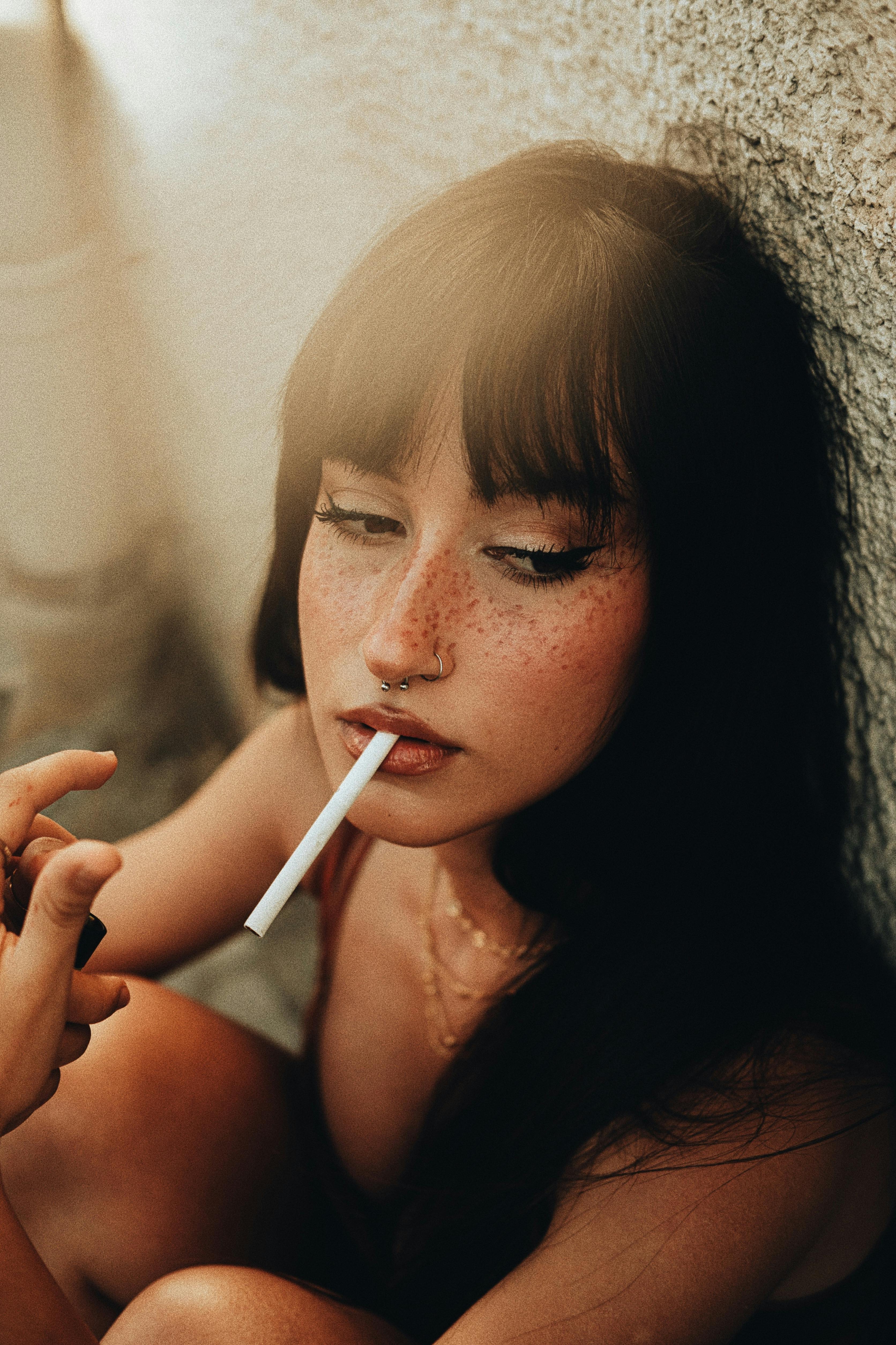 brunette with cigarette in mouth
