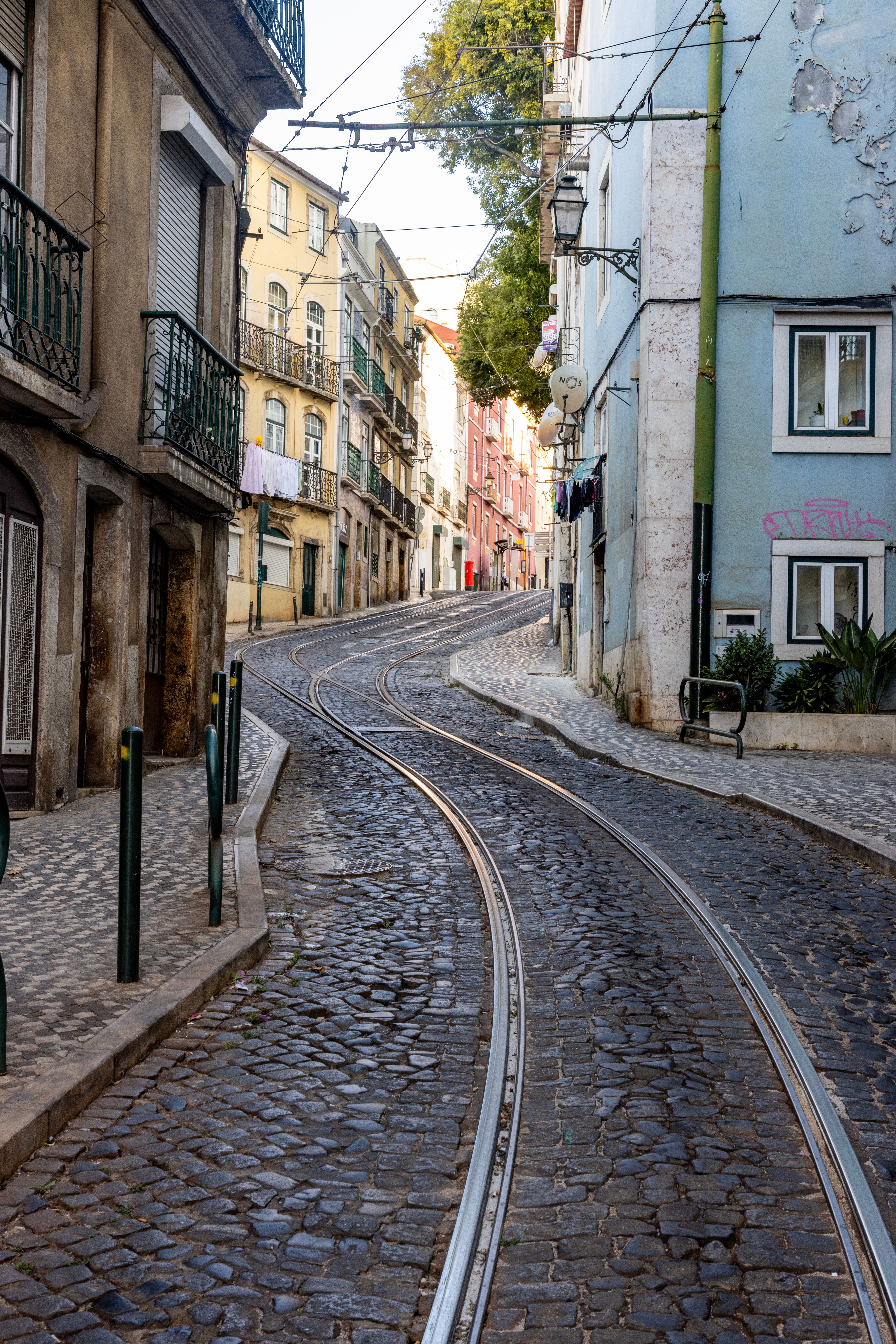 Tracks in a Narrow Street in Lisbon · Free Stock Photo