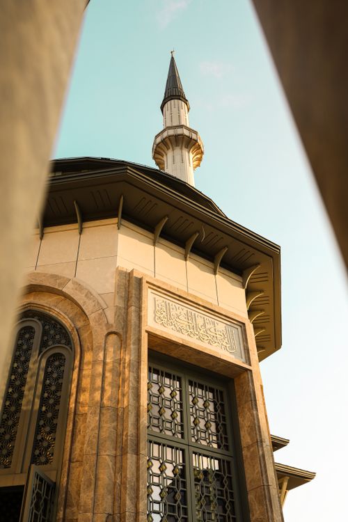 Free A striking view of a mosque's minaret in Istanbul, showcasing architectural elegance and cultural heritage. Stock Photo