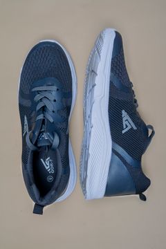 Navy running shoes — Arturo A on Pexels