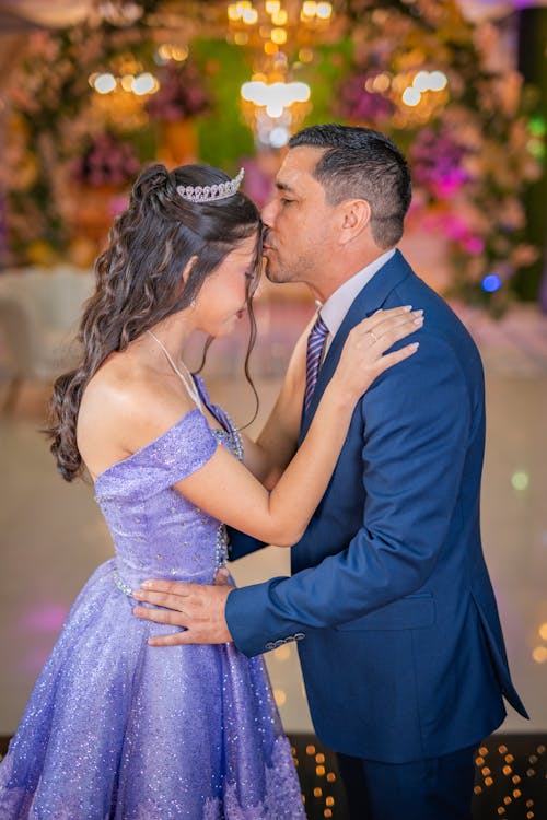 Father Kissing his Daughter at her 15th Birthday Party