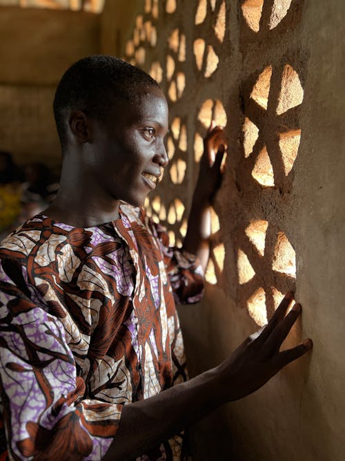 Young Man Looking through a Window 