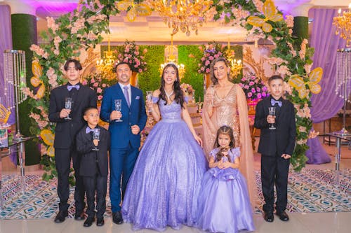 Newlywed Couple and Guests Posing for a Photo 