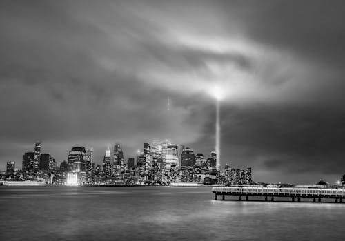 Black and White Photograph of a City Waterfront at Storm