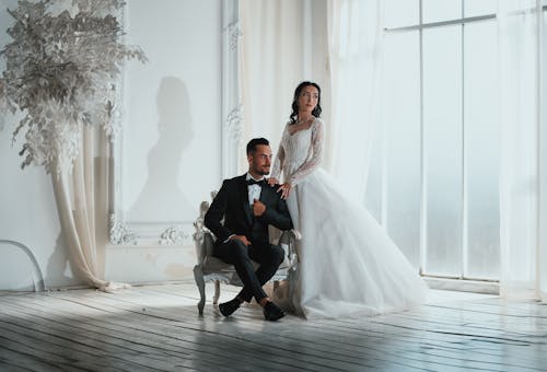 Newlyweds Pose in Elegant Room
