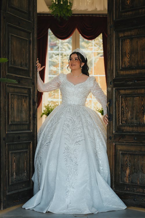 Bride Stands in Doorway