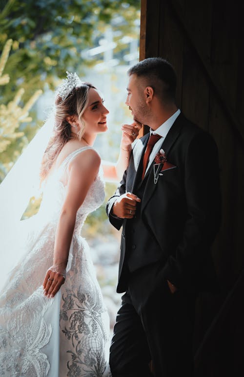 Newlyweds Stand in Doorway